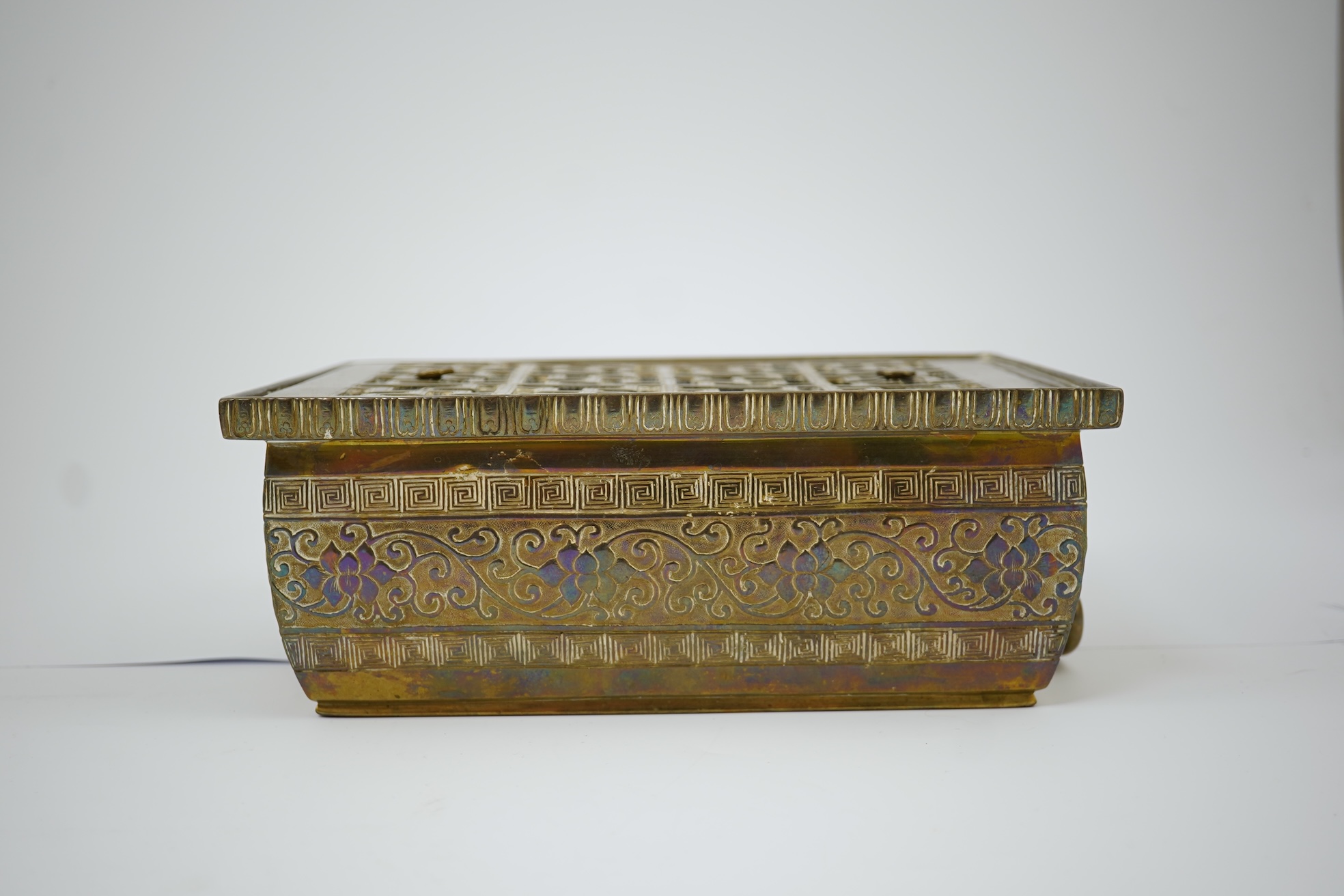 A large Chinese bronze rectangular censer and cover, Xuande seal mark, and a ‘plum blossom and chilong’ bronze censer, both 19th century